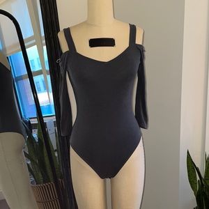 Ribbed cut out shoulder body suit with snaps